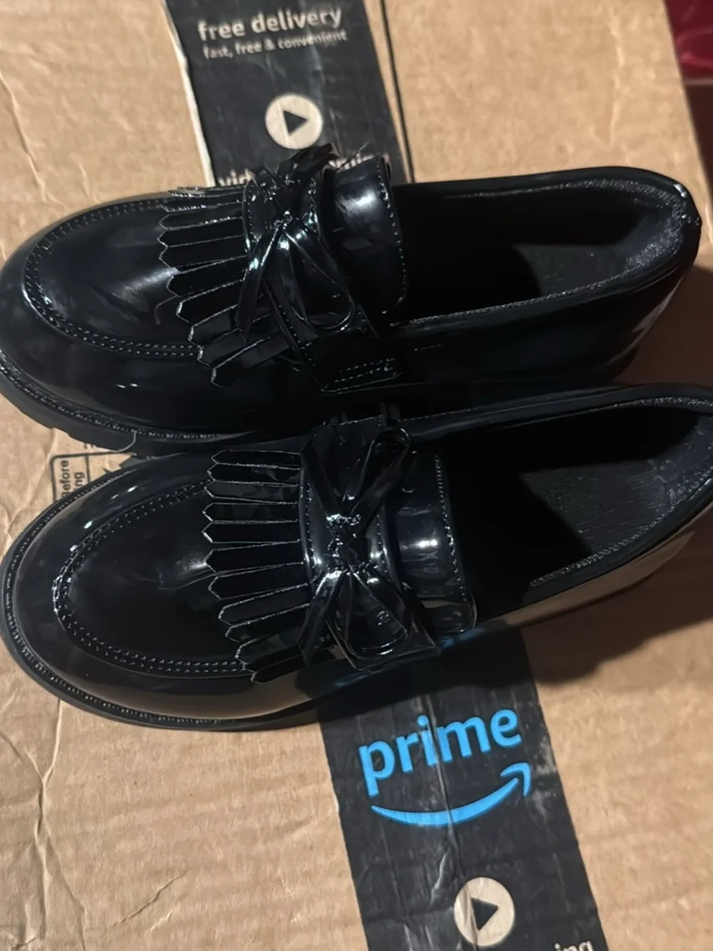Patent Leather Kiltie Fringe Loafers in Black